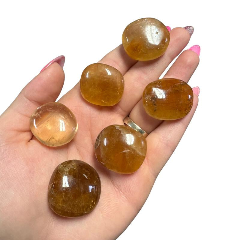 "Empower Your Energy: Natural Crystal Worry Stone 💎🌙" This gemstone coin pocket stone helps promote healing and focus, making it the perfect mini accessory for peace and balance on the go. 🌸✨