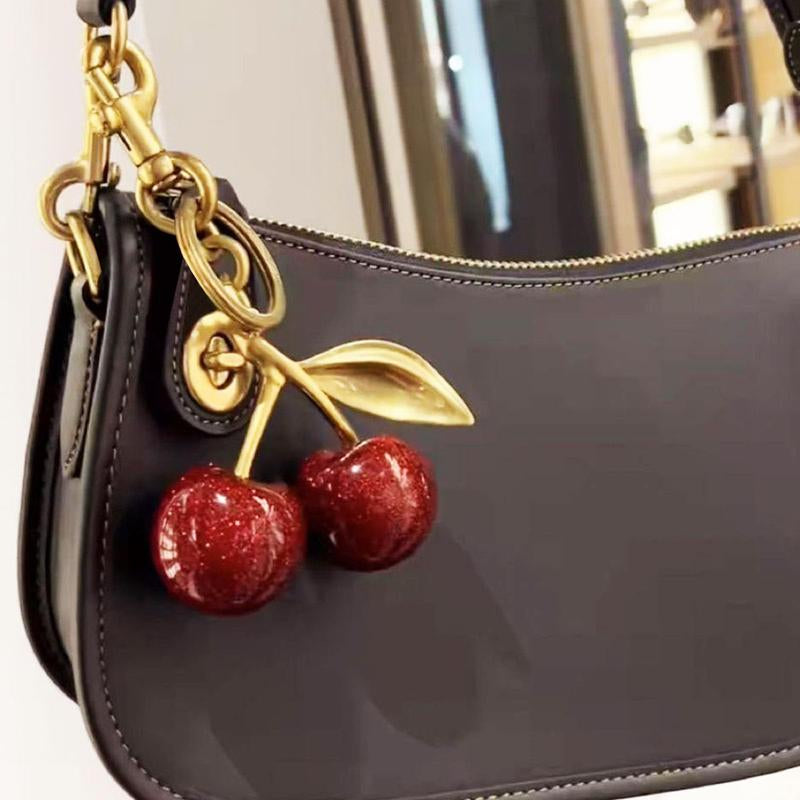 Fruitful Fashion: Cute Cherry Keychain 🍒💎" This adorable cherry keychain is a must-have accessory for women and girls—trendy, all-match, and ideal for gifting on any occasion. 🌟💖