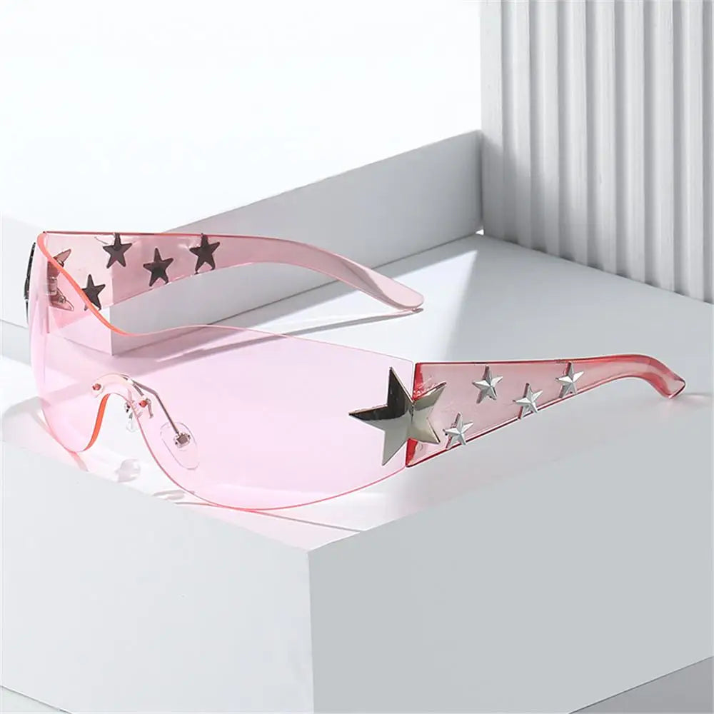 Star Power: Rimless Y2K Sunglasses for Trendsetters 🖤✨" Elevate your outdoor style with these rimless Y2K sunglasses, featuring a unique star wrap-around design perfect for men and women alike. 😎🌟