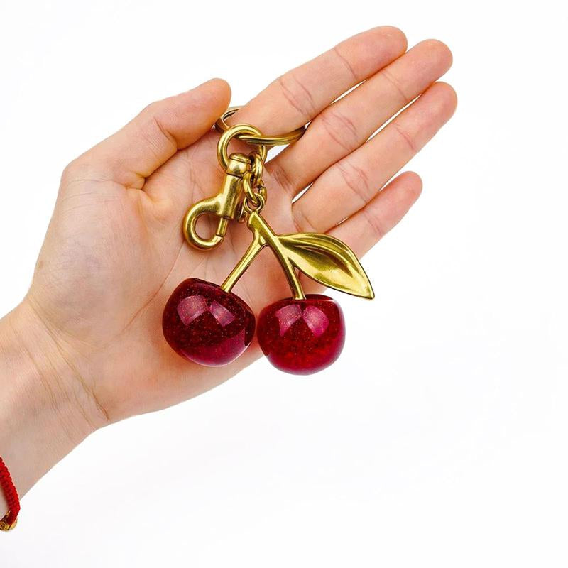 Fruitful Fashion: Cute Cherry Keychain 🍒💎" This adorable cherry keychain is a must-have accessory for women and girls—trendy, all-match, and ideal for gifting on any occasion. 🌟💖