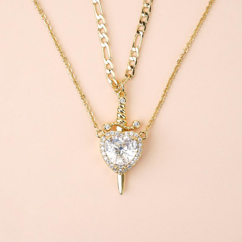 Eternal Love: Heart & Dagger Cross Pendant Necklace 💖⚔️" A stunning gift for couples, this heart and rhinestone dagger cross pendant necklace blends elegance and bold style, perfect for expressing your unique bond. ✨💎