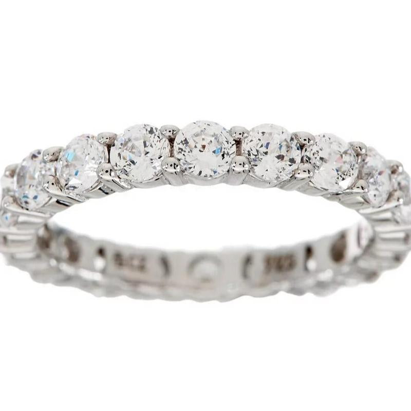 "Infinite Sparkle: Diamonique 100-Facet Eternity Ring 💎🌟" With 100 brilliant facets, this eternity band ring features the stunning clarity of Diamonique, available in 14K Clad or Sterling, making it a symbol of everlasting beauty. 💖💍