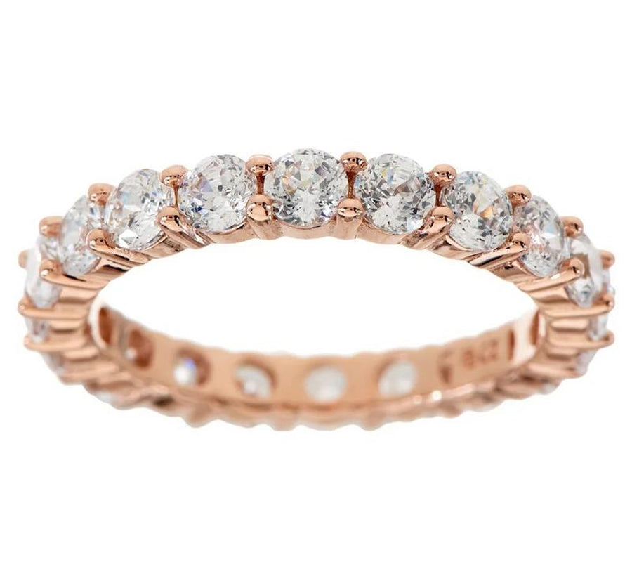 "Infinite Sparkle: Diamonique 100-Facet Eternity Ring 💎🌟" With 100 brilliant facets, this eternity band ring features the stunning clarity of Diamonique, available in 14K Clad or Sterling, making it a symbol of everlasting beauty. 💖💍