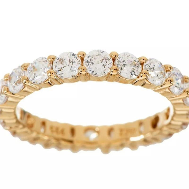 "Infinite Sparkle: Diamonique 100-Facet Eternity Ring 💎🌟" With 100 brilliant facets, this eternity band ring features the stunning clarity of Diamonique, available in 14K Clad or Sterling, making it a symbol of everlasting beauty. 💖💍