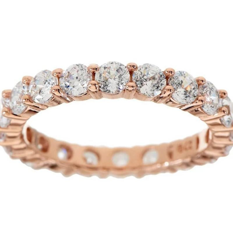 "Infinite Sparkle: Diamonique 100-Facet Eternity Ring 💎🌟" With 100 brilliant facets, this eternity band ring features the stunning clarity of Diamonique, available in 14K Clad or Sterling, making it a symbol of everlasting beauty. 💖💍