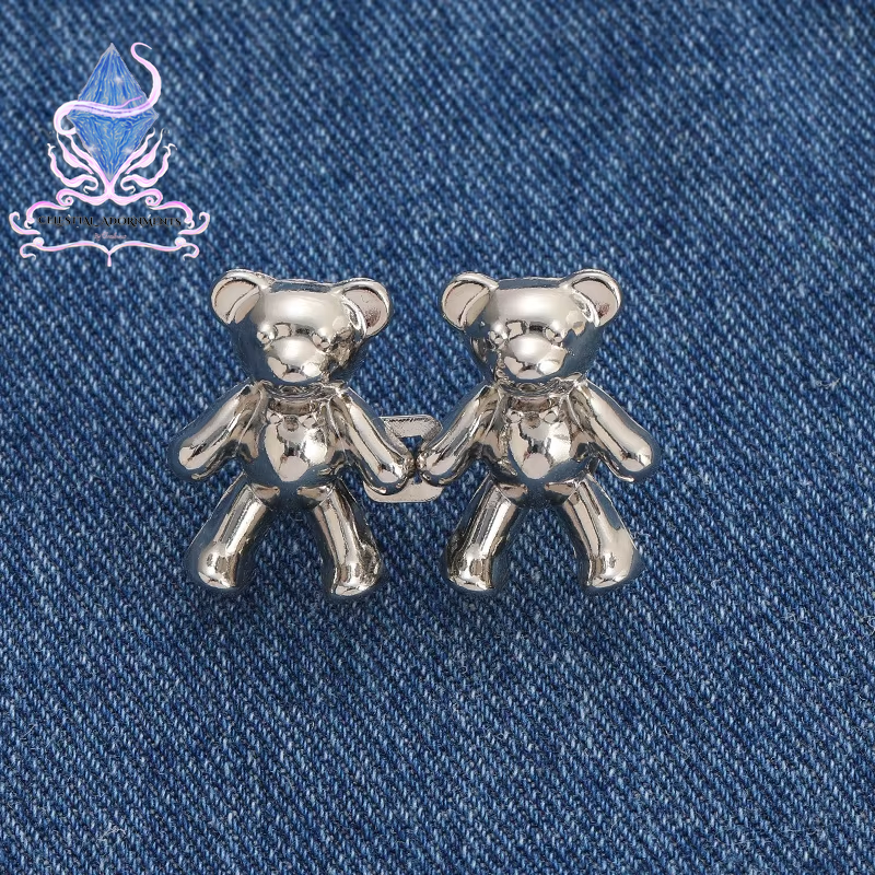 "Bear-ly Fit: Adjustable Jean Button Pins 🐻👖" Instantly tighten your jeans with these adorable bear-shaped button pins—no sewing required! Perfect for a cute, quick fix. ✨💖