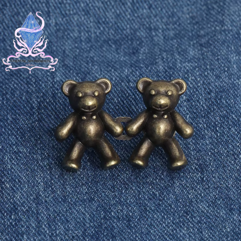 "Bear-ly Fit: Adjustable Jean Button Pins 🐻👖" Instantly tighten your jeans with these adorable bear-shaped button pins—no sewing required! Perfect for a cute, quick fix. ✨💖