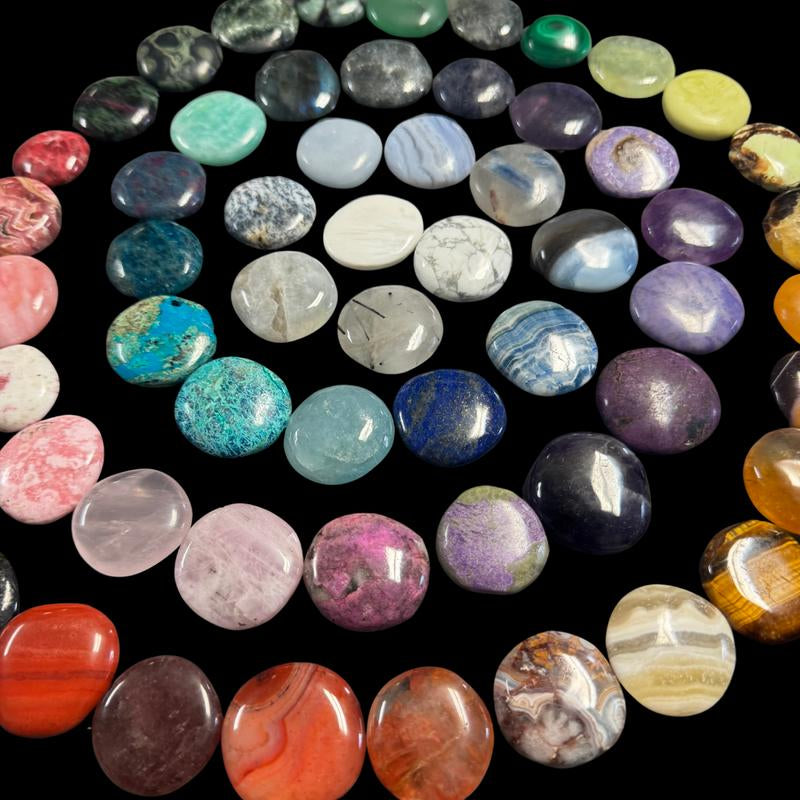 "Empower Your Energy: Natural Crystal Worry Stone 💎🌙"  This gemstone coin pocket stone helps promote healing and focus, making it the perfect mini accessory for peace and balance on the go. 🌸✨