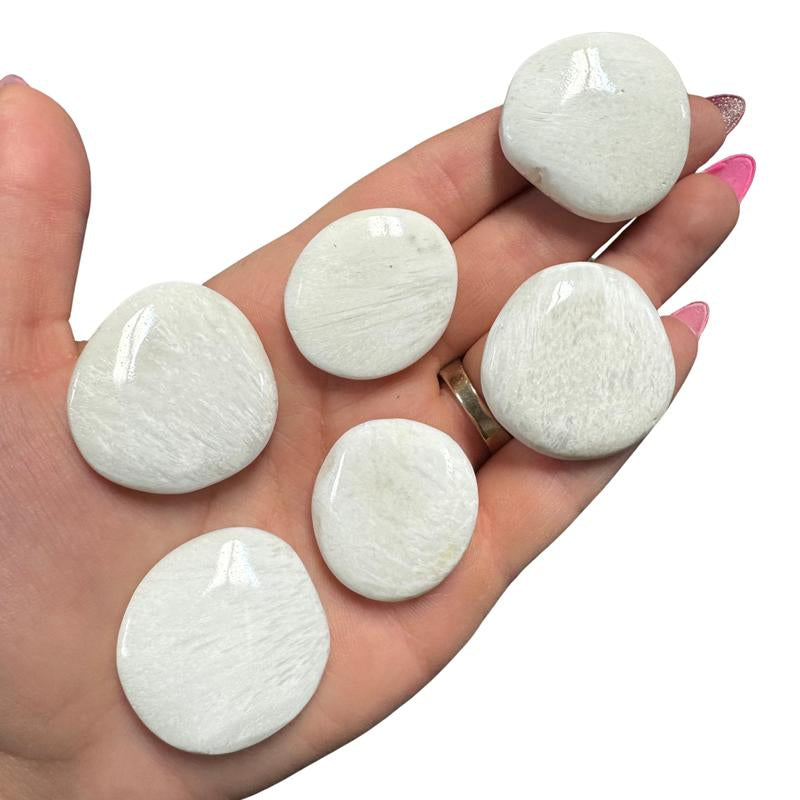 "Empower Your Energy: Natural Crystal Worry Stone 💎🌙"  This gemstone coin pocket stone helps promote healing and focus, making it the perfect mini accessory for peace and balance on the go. 🌸✨