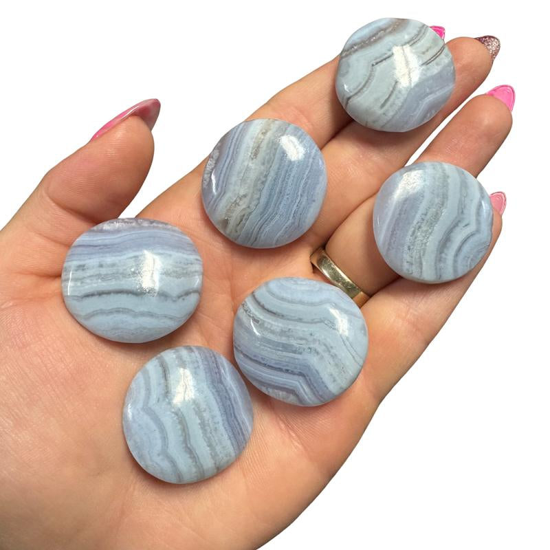 "Empower Your Energy: Natural Crystal Worry Stone 💎🌙"  This gemstone coin pocket stone helps promote healing and focus, making it the perfect mini accessory for peace and balance on the go. 🌸✨