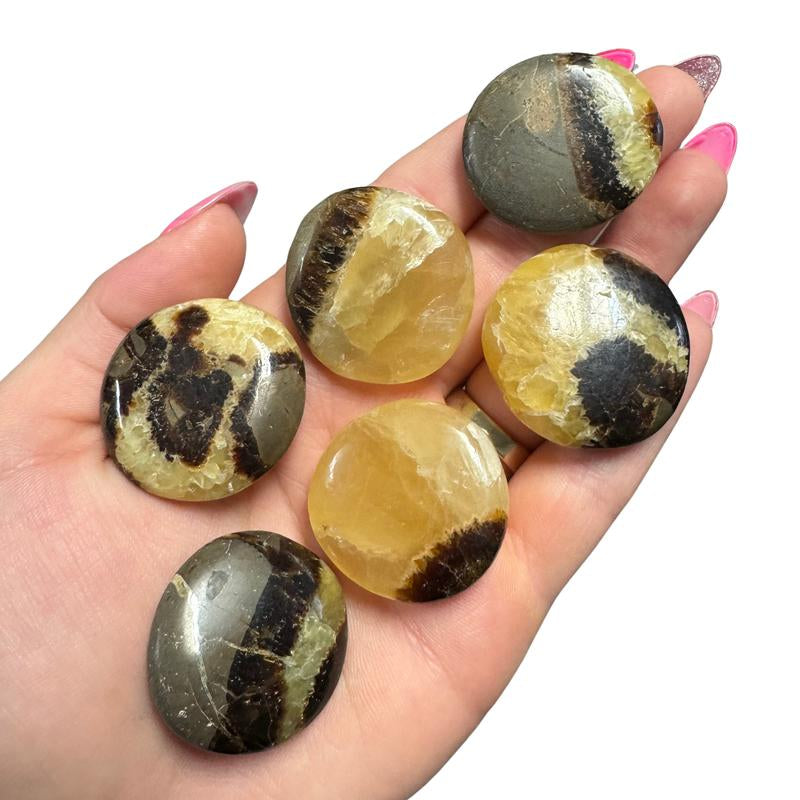 "Empower Your Energy: Natural Crystal Worry Stone 💎🌙"  This gemstone coin pocket stone helps promote healing and focus, making it the perfect mini accessory for peace and balance on the go. 🌸✨