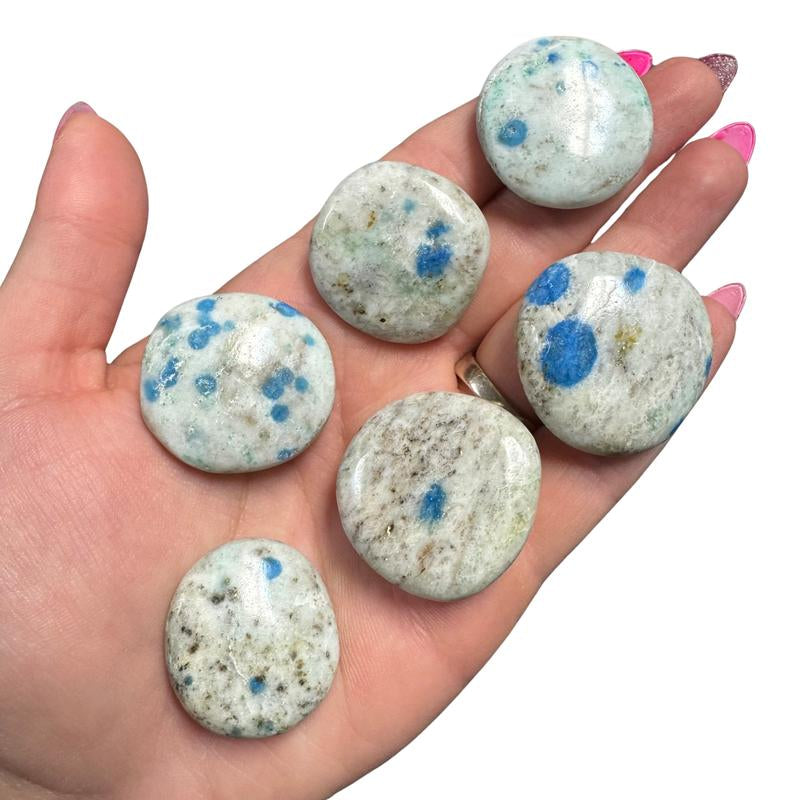 "Empower Your Energy: Natural Crystal Worry Stone 💎🌙"  This gemstone coin pocket stone helps promote healing and focus, making it the perfect mini accessory for peace and balance on the go. 🌸✨