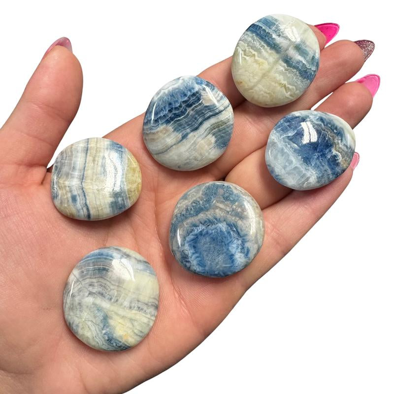 "Empower Your Energy: Natural Crystal Worry Stone 💎🌙"  This gemstone coin pocket stone helps promote healing and focus, making it the perfect mini accessory for peace and balance on the go. 🌸✨