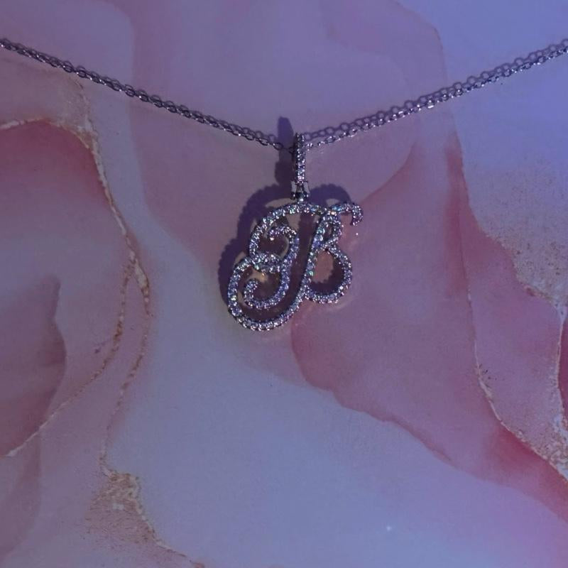 "Personalized Elegance: Custom Script Initial Necklace ✨💖"  Make it yours with this personalized script initial necklace, crafted from stainless steel for a stylish and meaningful touch. 💎🌟