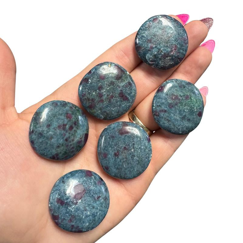 "Empower Your Energy: Natural Crystal Worry Stone 💎🌙"  This gemstone coin pocket stone helps promote healing and focus, making it the perfect mini accessory for peace and balance on the go. 🌸✨