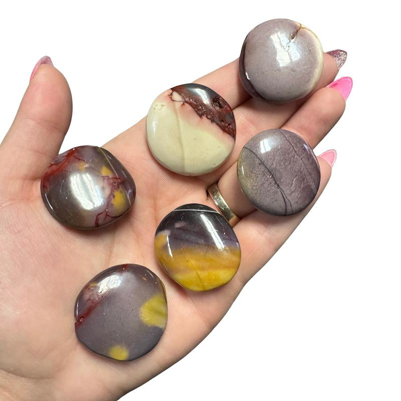 "Empower Your Energy: Natural Crystal Worry Stone 💎🌙"  This gemstone coin pocket stone helps promote healing and focus, making it the perfect mini accessory for peace and balance on the go. 🌸✨