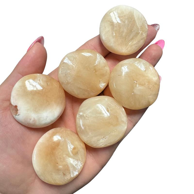 "Empower Your Energy: Natural Crystal Worry Stone 💎🌙"  This gemstone coin pocket stone helps promote healing and focus, making it the perfect mini accessory for peace and balance on the go. 🌸✨