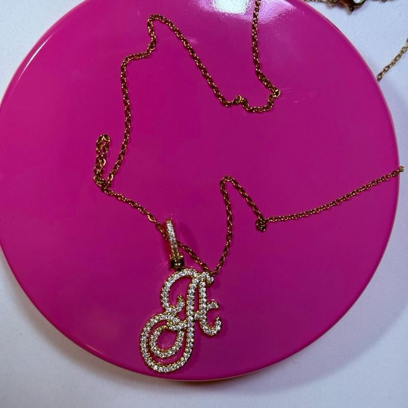 "Personalized Elegance: Custom Script Initial Necklace ✨💖"  Make it yours with this personalized script initial necklace, crafted from stainless steel for a stylish and meaningful touch. 💎🌟