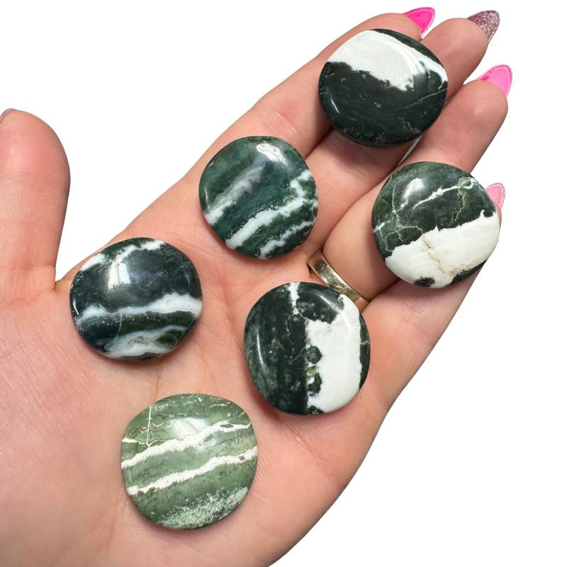 "Empower Your Energy: Natural Crystal Worry Stone 💎🌙"  This gemstone coin pocket stone helps promote healing and focus, making it the perfect mini accessory for peace and balance on the go. 🌸✨