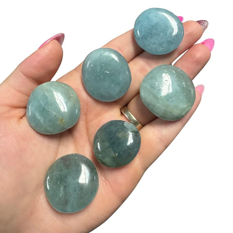 "Empower Your Energy: Natural Crystal Worry Stone 💎🌙"  This gemstone coin pocket stone helps promote healing and focus, making it the perfect mini accessory for peace and balance on the go. 🌸✨