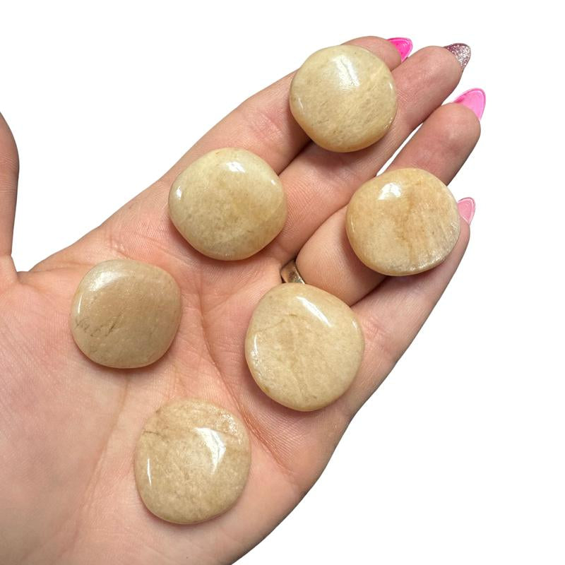 "Empower Your Energy: Natural Crystal Worry Stone 💎🌙"  This gemstone coin pocket stone helps promote healing and focus, making it the perfect mini accessory for peace and balance on the go. 🌸✨