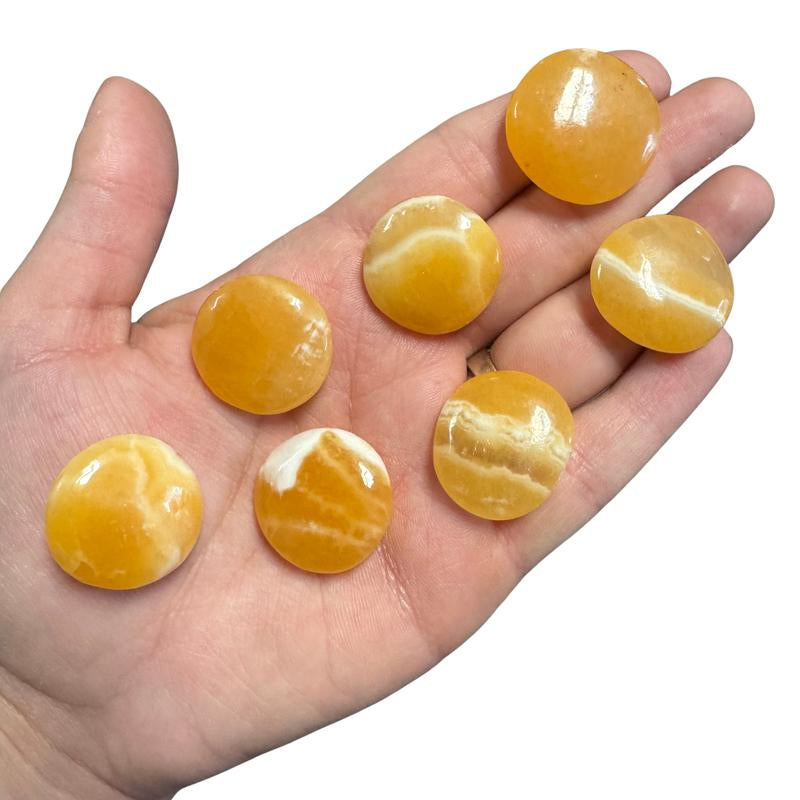 "Empower Your Energy: Natural Crystal Worry Stone 💎🌙"  This gemstone coin pocket stone helps promote healing and focus, making it the perfect mini accessory for peace and balance on the go. 🌸✨