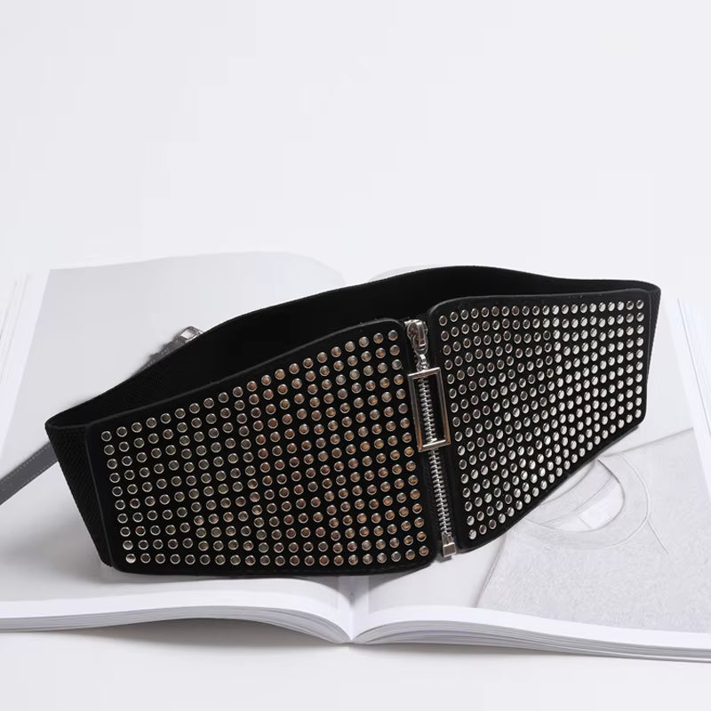 "Gothic Glam: Rivet Inlay Corset Belt for Women 🔥🖤"  Add an edge to your outfit with this wide elastic corset belt, complete with rivet inlays for a stunning gothic look that embraces punk and alternative style. ✨🖤