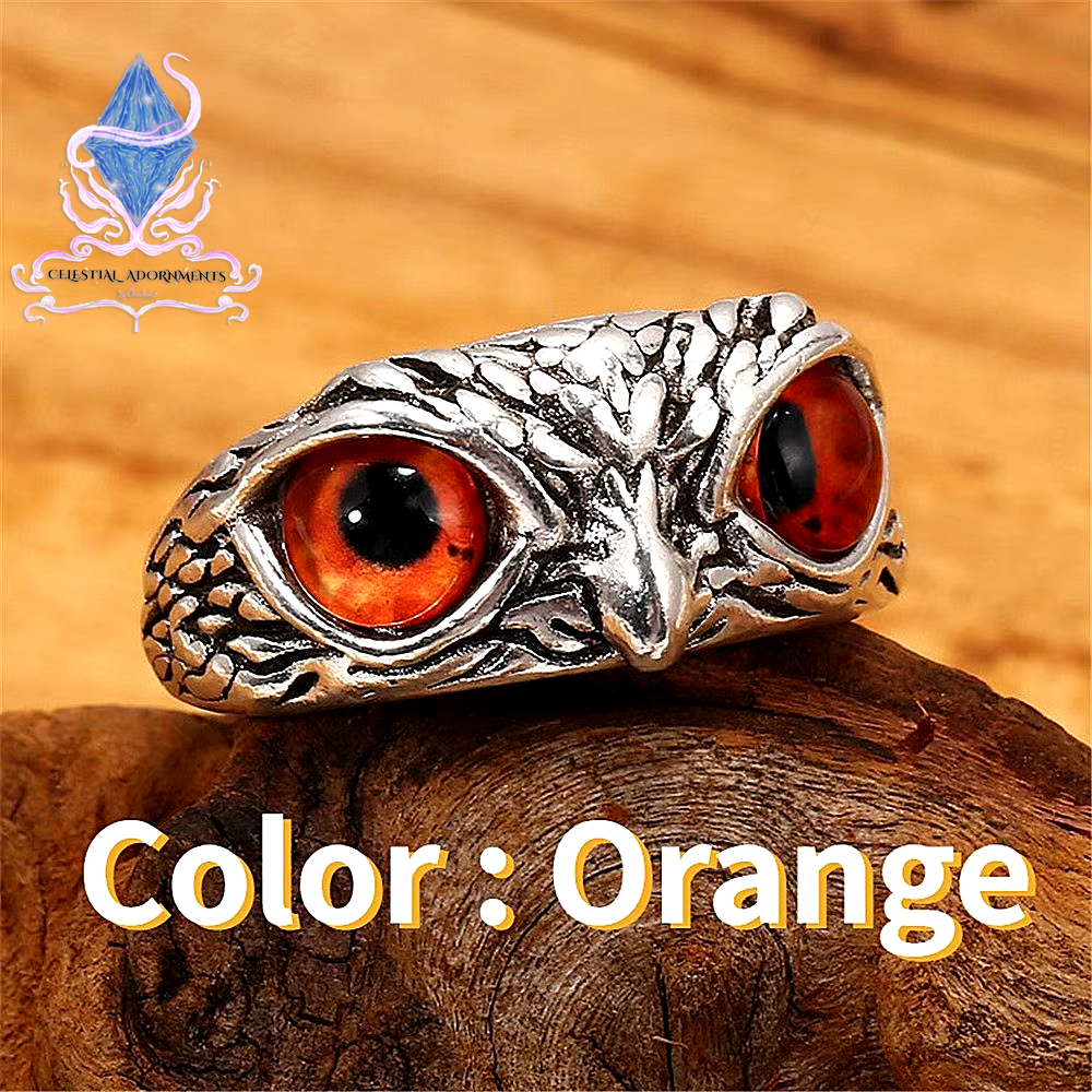 "Enchanting Owl: Colorful Cat Eye Gothic Ring 🦉✨"  A perfect blend of mysticism and style, this adjustable owl ring with a colorful cat-eye stone is a unique and trendy piece for both men and women. 💖💎
