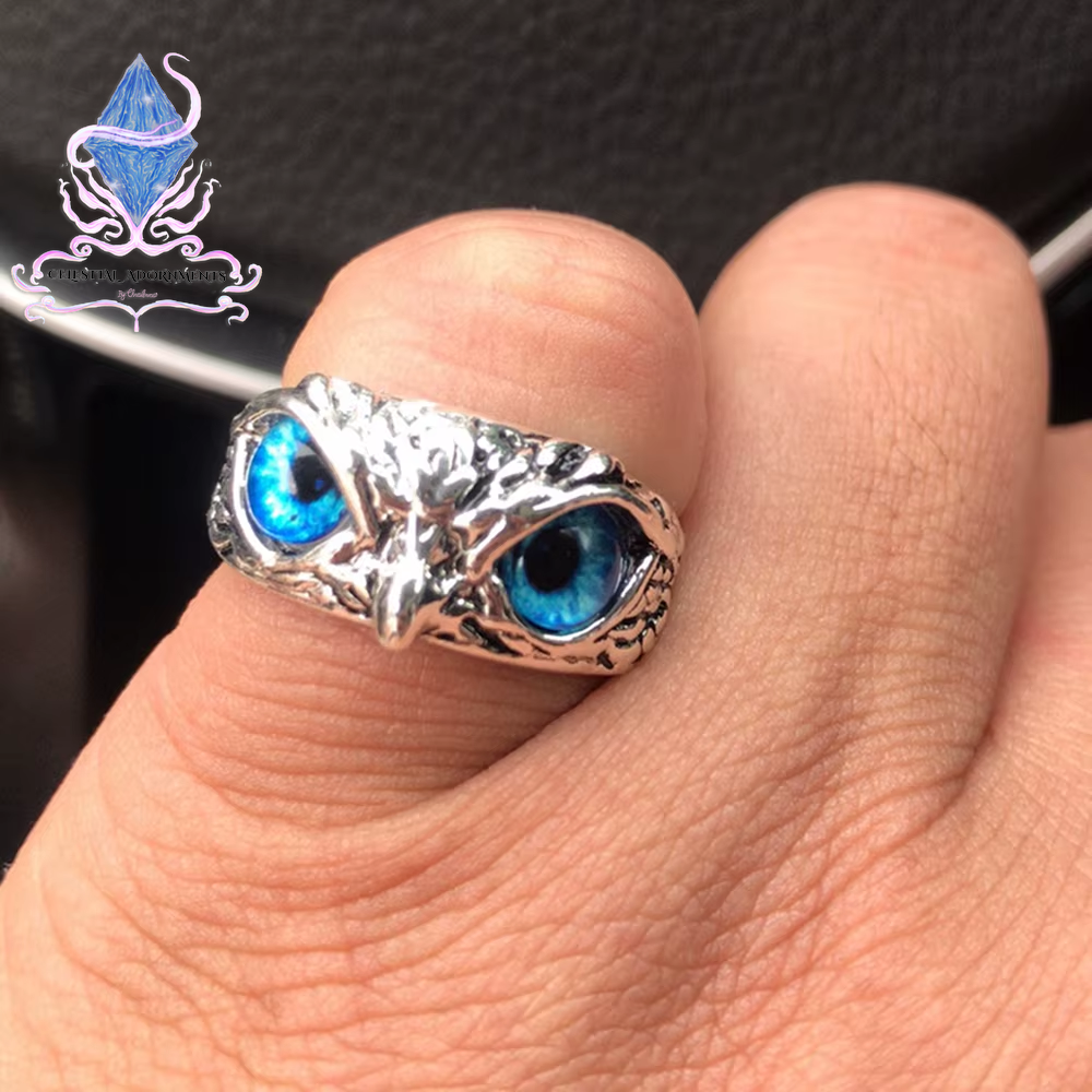 "Enchanting Owl: Colorful Cat Eye Gothic Ring 🦉✨"  A perfect blend of mysticism and style, this adjustable owl ring with a colorful cat-eye stone is a unique and trendy piece for both men and women. 💖💎