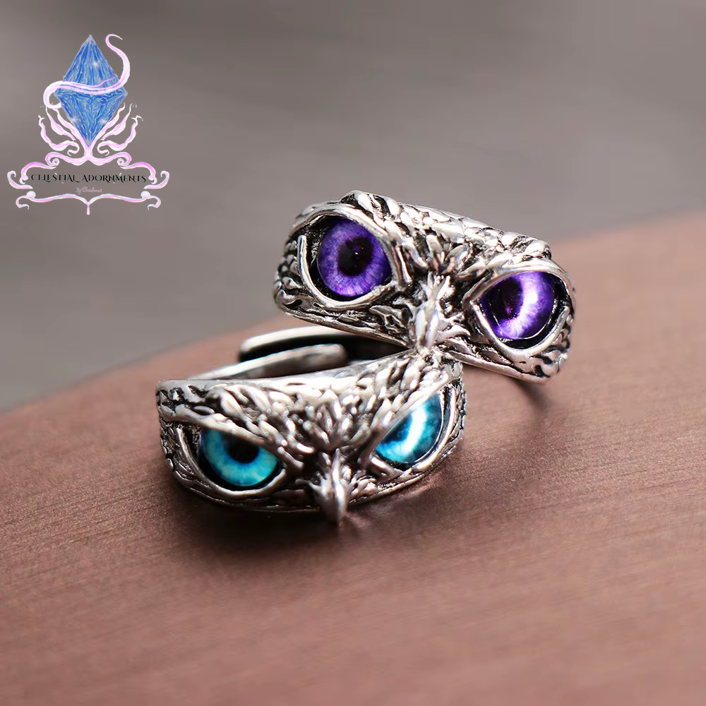 "Enchanting Owl: Colorful Cat Eye Gothic Ring 🦉✨"  A perfect blend of mysticism and style, this adjustable owl ring with a colorful cat-eye stone is a unique and trendy piece for both men and women. 💖💎