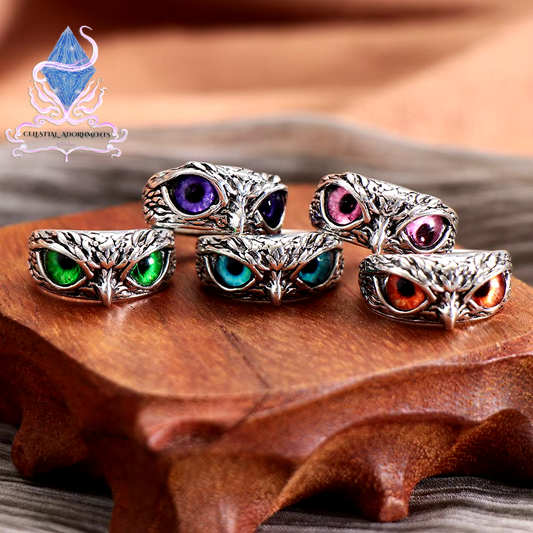 "Enchanting Owl: Colorful Cat Eye Gothic Ring 🦉✨"  A perfect blend of mysticism and style, this adjustable owl ring with a colorful cat-eye stone is a unique and trendy piece for both men and women. 💖💎