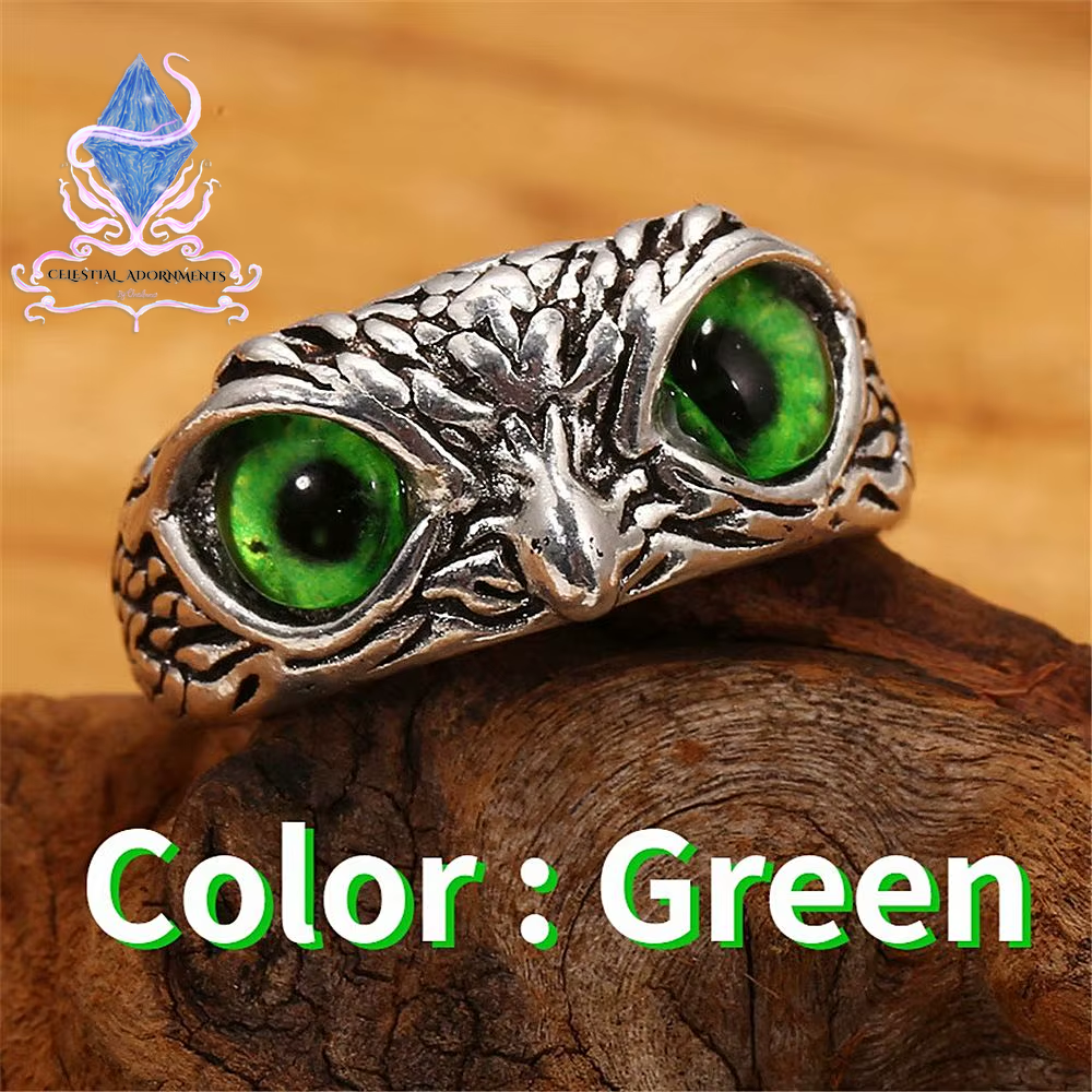 "Enchanting Owl: Colorful Cat Eye Gothic Ring 🦉✨"  A perfect blend of mysticism and style, this adjustable owl ring with a colorful cat-eye stone is a unique and trendy piece for both men and women. 💖💎