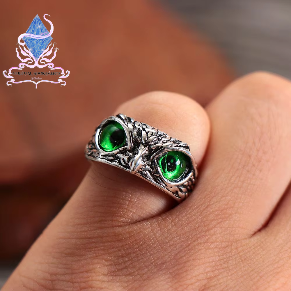 "Enchanting Owl: Colorful Cat Eye Gothic Ring 🦉✨"  A perfect blend of mysticism and style, this adjustable owl ring with a colorful cat-eye stone is a unique and trendy piece for both men and women. 💖💎